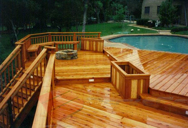 Pool-side Relaxation Even soaking wet this multi-level pool deck is glamorous. It features ample seating and sunning areas, a fire-pit, and a flower box.
