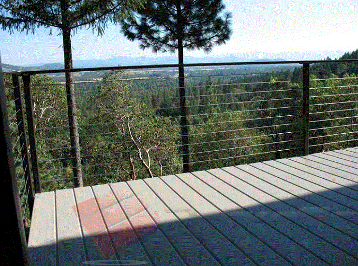 Tree-top Aluminum Railing with Cable Wire and Aluminum Decking The breathtaking tree-top view is expertly complemented by the aluminum railing with cable wire and aluminum decking.