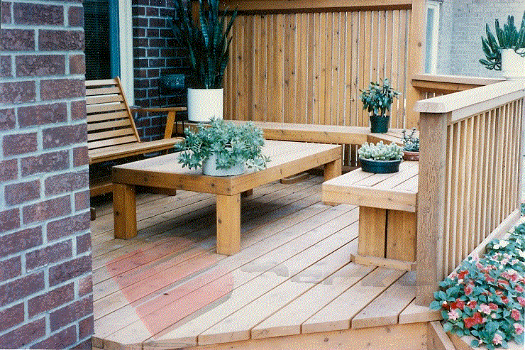 Cedar Privacy Panels This cedar deck features ample seating area with built in benches and a 2x2 privacy wall.