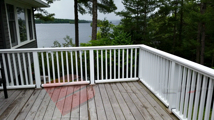 Classic and Simple Aluminum Railing This image illustrates a classic approach to building a deck and accompanying railing.