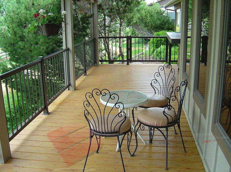 This image features elegant aluminum railings paired with equally elegant aluminum decking boards. To say this deck is magnificent is an understatement.
