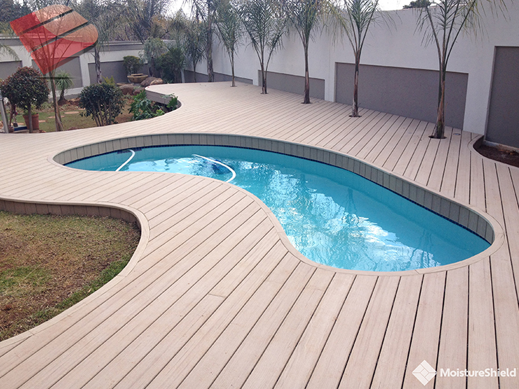 Even soaking wet this multi-level pool deck is glamorous. It features ample seating and sunning areas, a fire-pit, and a flower box.