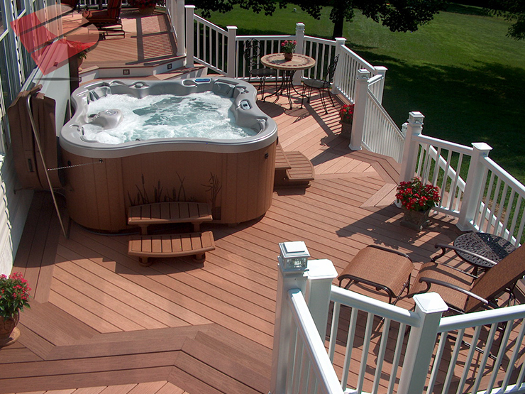 Even soaking wet this multi-level pool deck is glamorous. It features ample seating and sunning areas, a fire-pit, and a flower box.