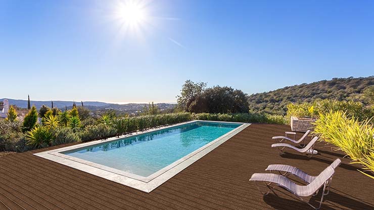 In ground pool surrounded by desert view