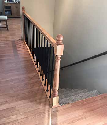Indoor stair landing with snap lock balusters