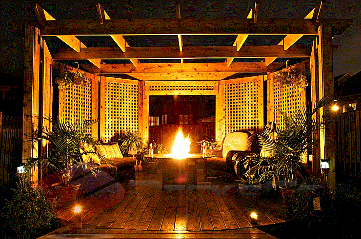 Illuminate Your Pergola Dreams This deck brings together anyone's backyard dreams. The pergola coupled with flooring lighting and a fire-pit is breath-taking.