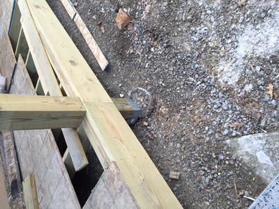 Post bracket off to the  far side of the concrete pier