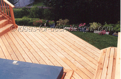 Deck boards set at a 45 degree angle provide wisual and directional continuity from the hot tub deck to the stairs and upper deck