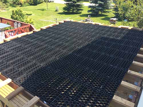 Silca grid over wood framed deck.