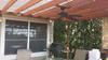 Close view of pergola roof against house
