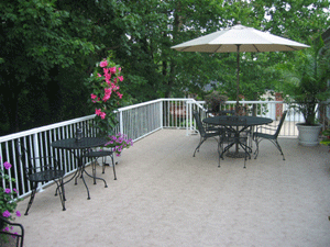 Duradeck with a market umbrella and chairs